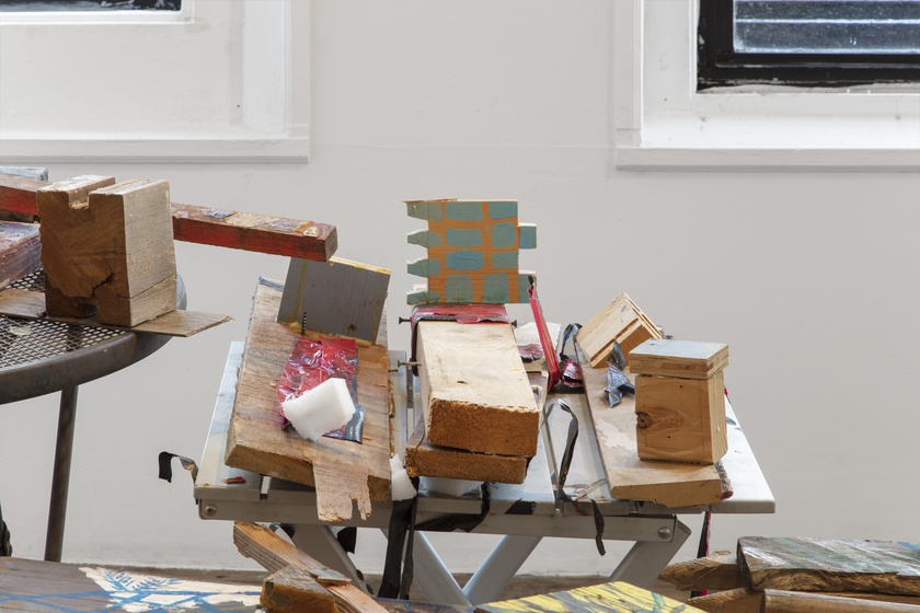 Metal chairs, tables, wood, acrylic on wood, glue, hardware, brick, duct tape, polyurethane foam, coins, nylon, latex paint on wood 95 × 50 ½ × 34 in. (241.30 × 128.27 × 86.36 cm); Photo by Gregory Carideo